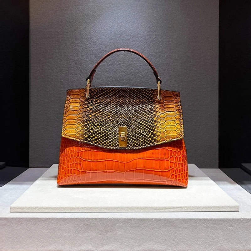 Handbag with two-tone design on a gray background