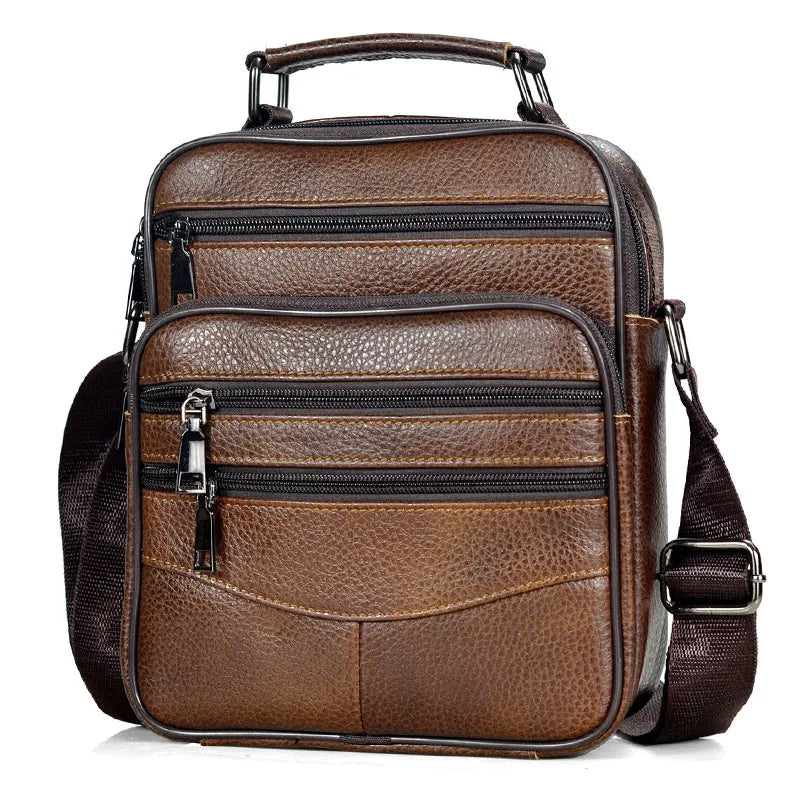 Brown leather backpack with multiple compartments on a white background