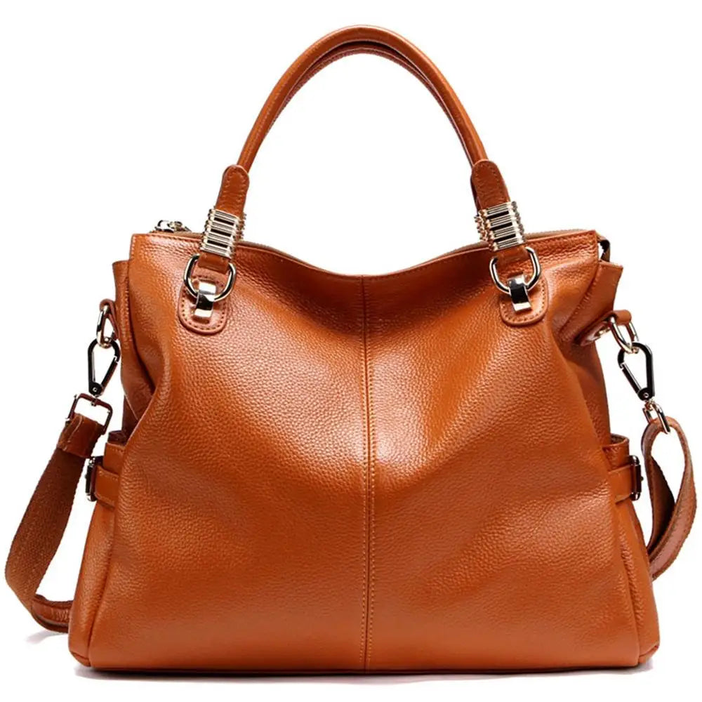 Brown leather handbag with gold hardware on a white background
