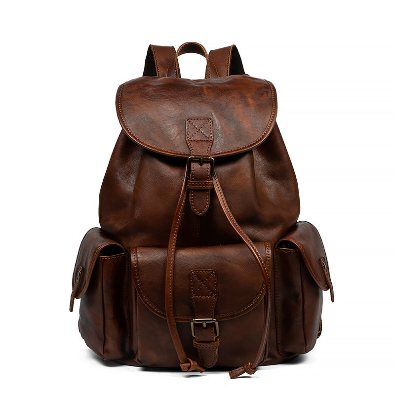 Brown leather backpack on a white background