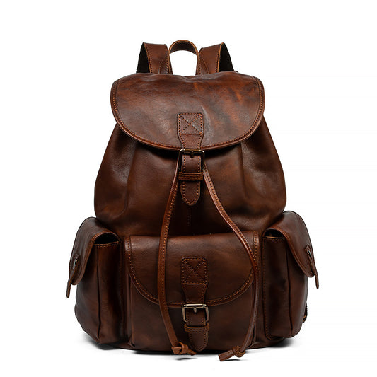 Brown leather backpack on a white background