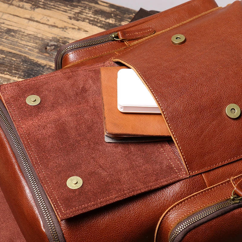Brown leather bag with a card holder on a wooden surface