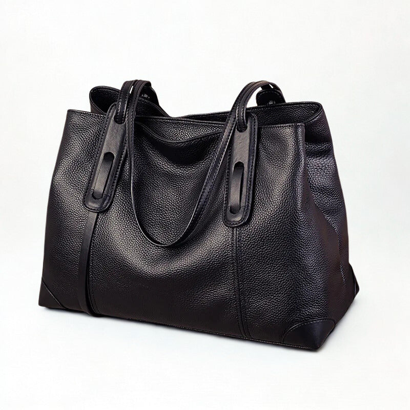 Black leather handbag on a white background