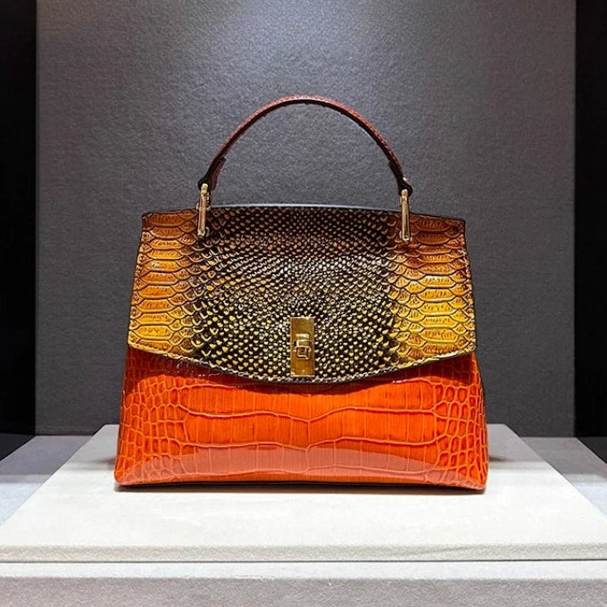 Handbag with two-tone design on a gray background