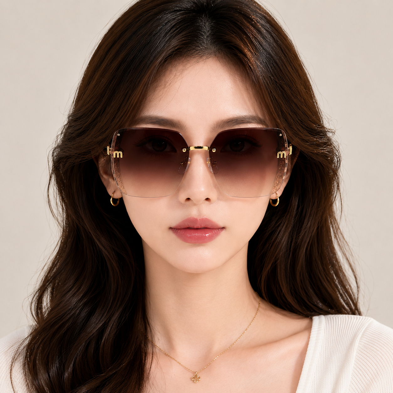 Woman wearing stylish sunglasses with a neutral background
